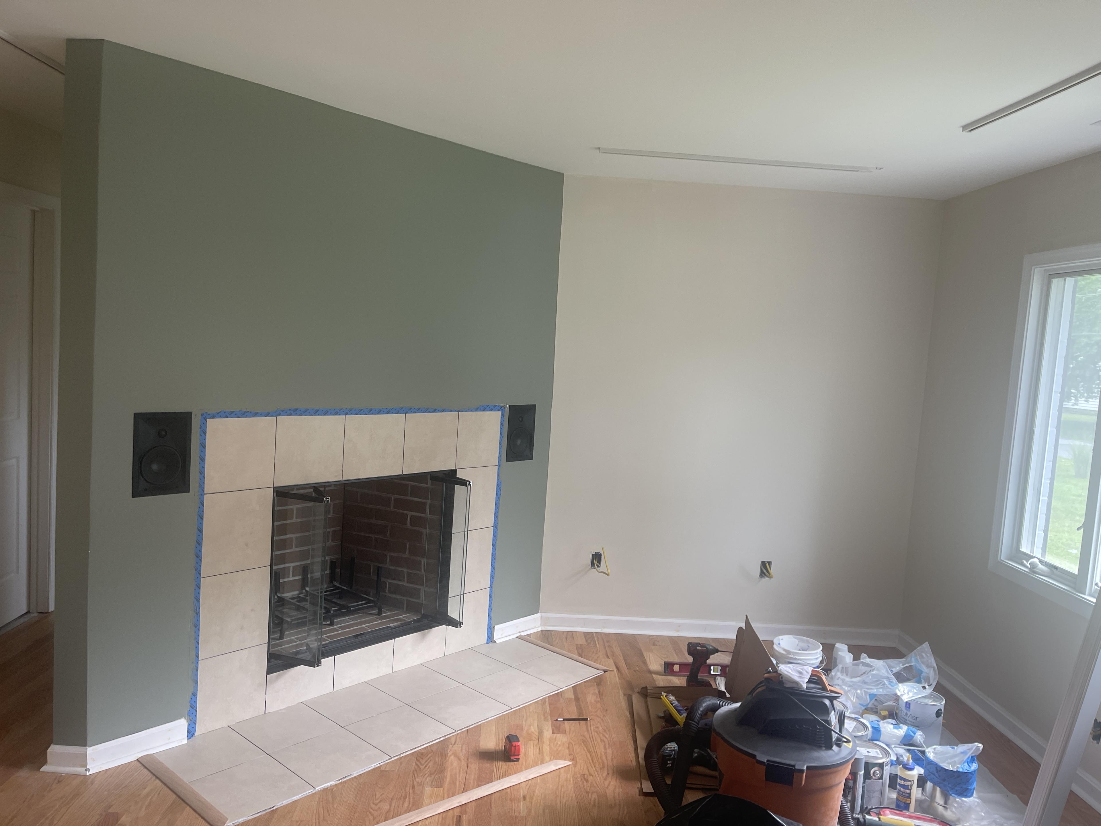 Fireplace surround and wall finish work in progress