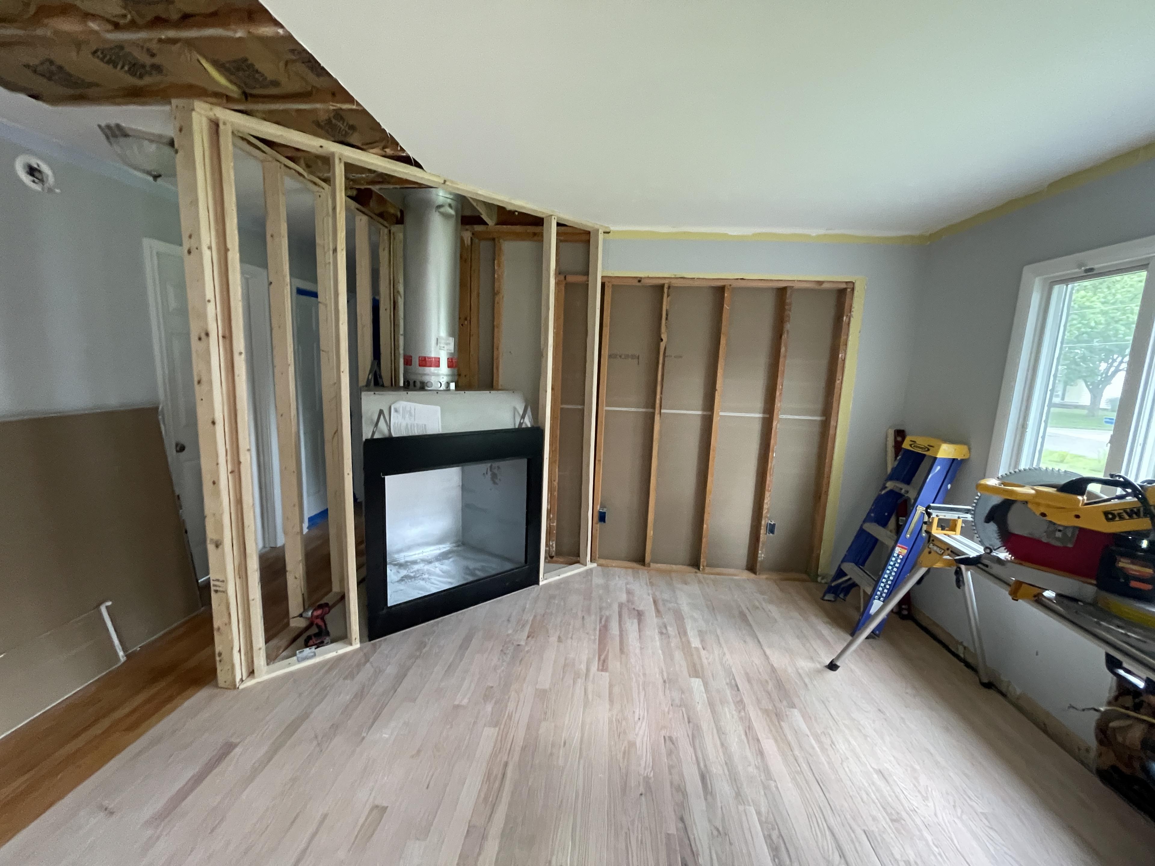 Fireplace framing and installation in progress