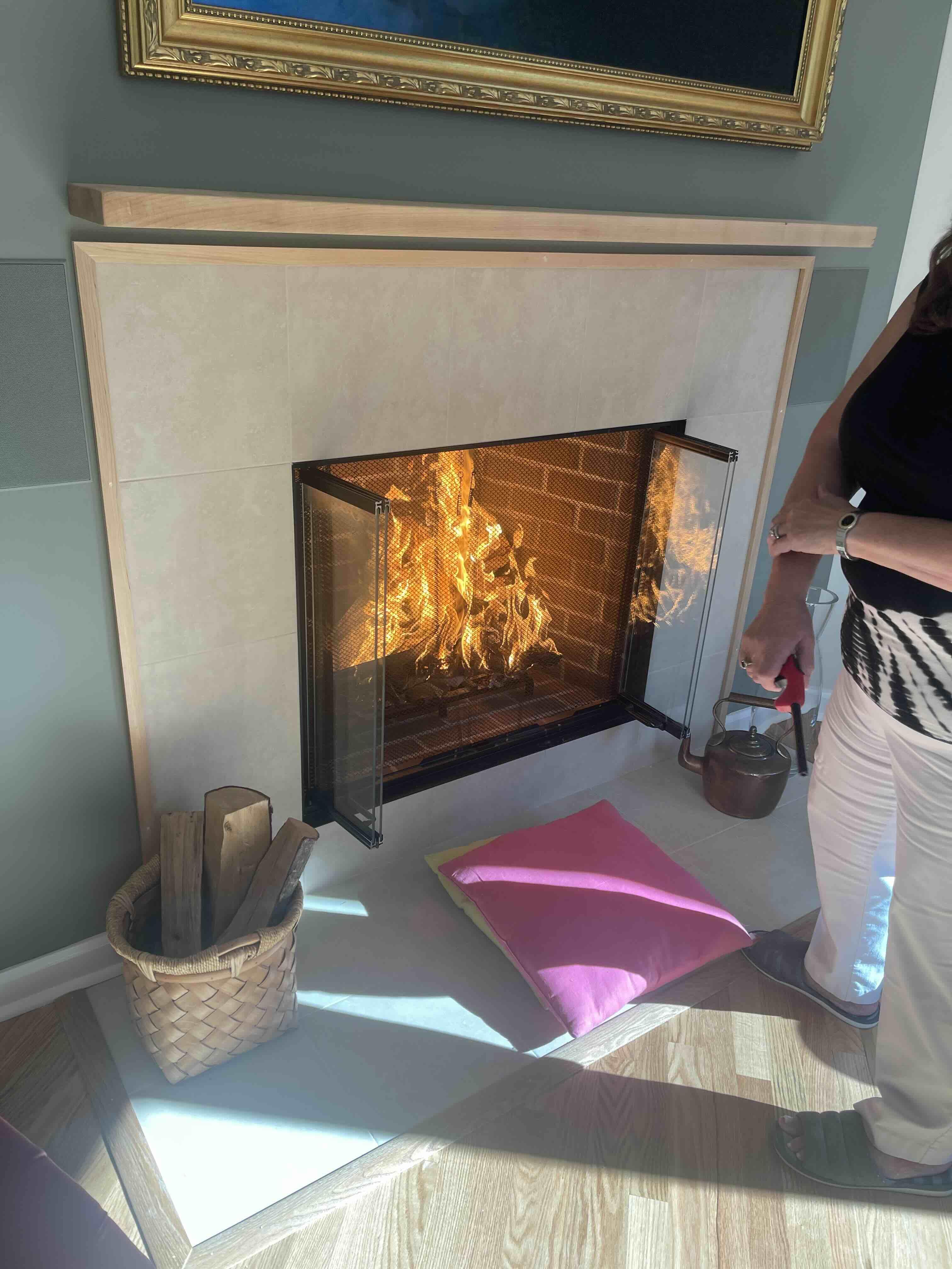 Finished fireplace with a lit fire
