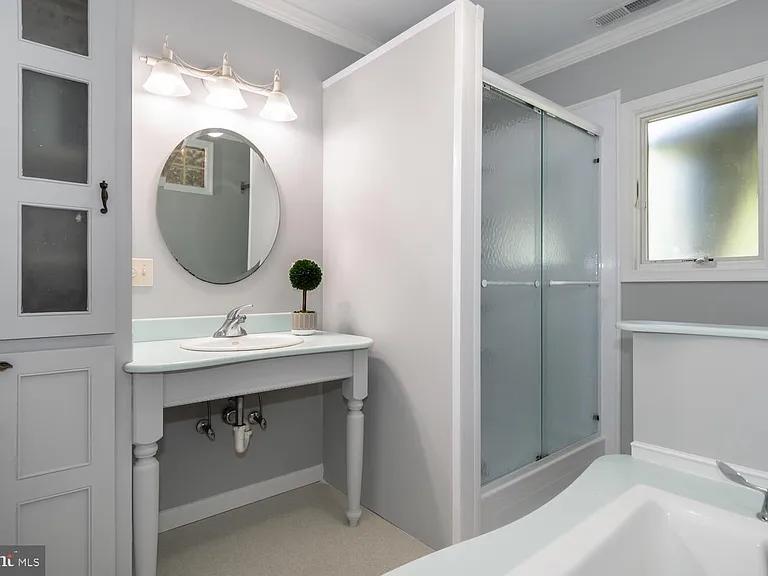 Master bath before remodeling showing vanity, shower, and tub layout